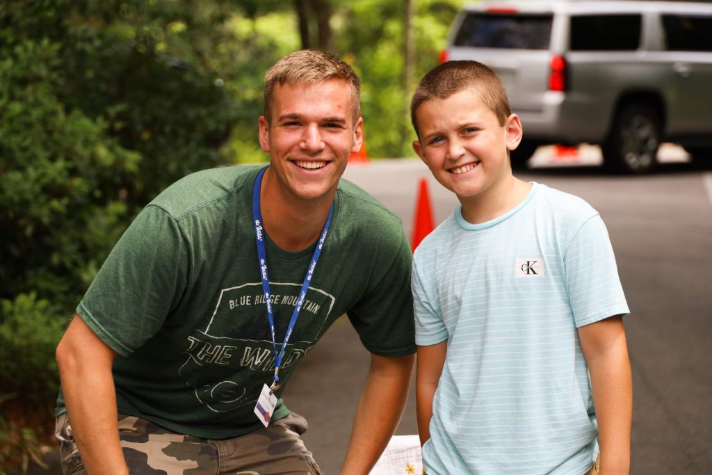 A camper with his counselor