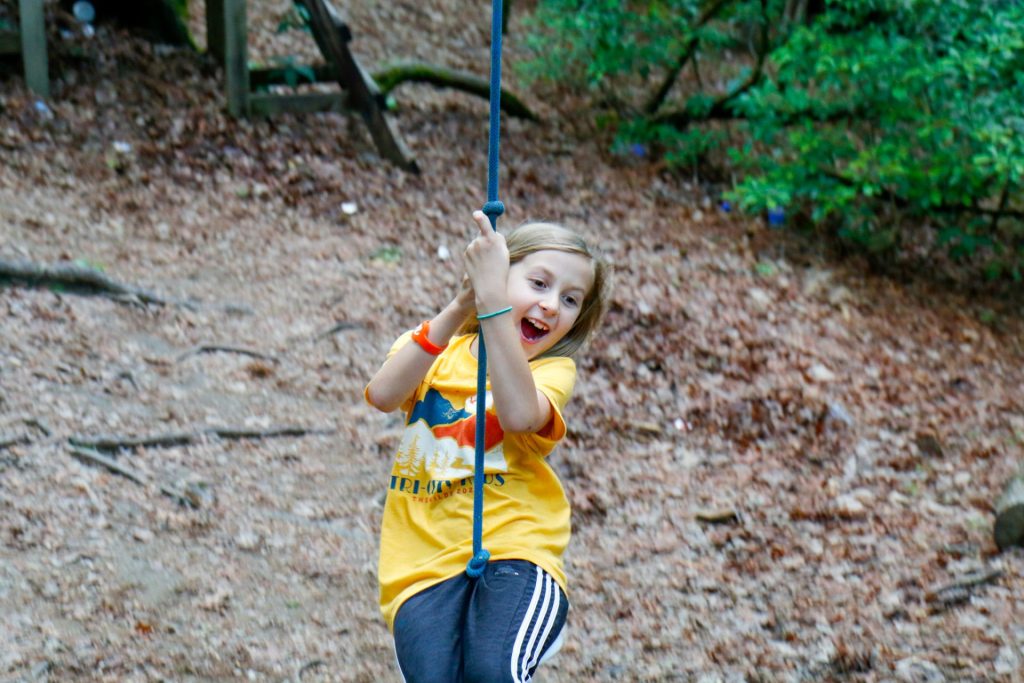 Camper on rope swing